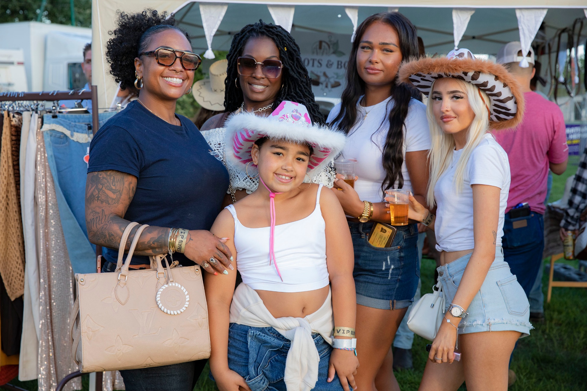 Festival-goers at the Boots & Bling stall.