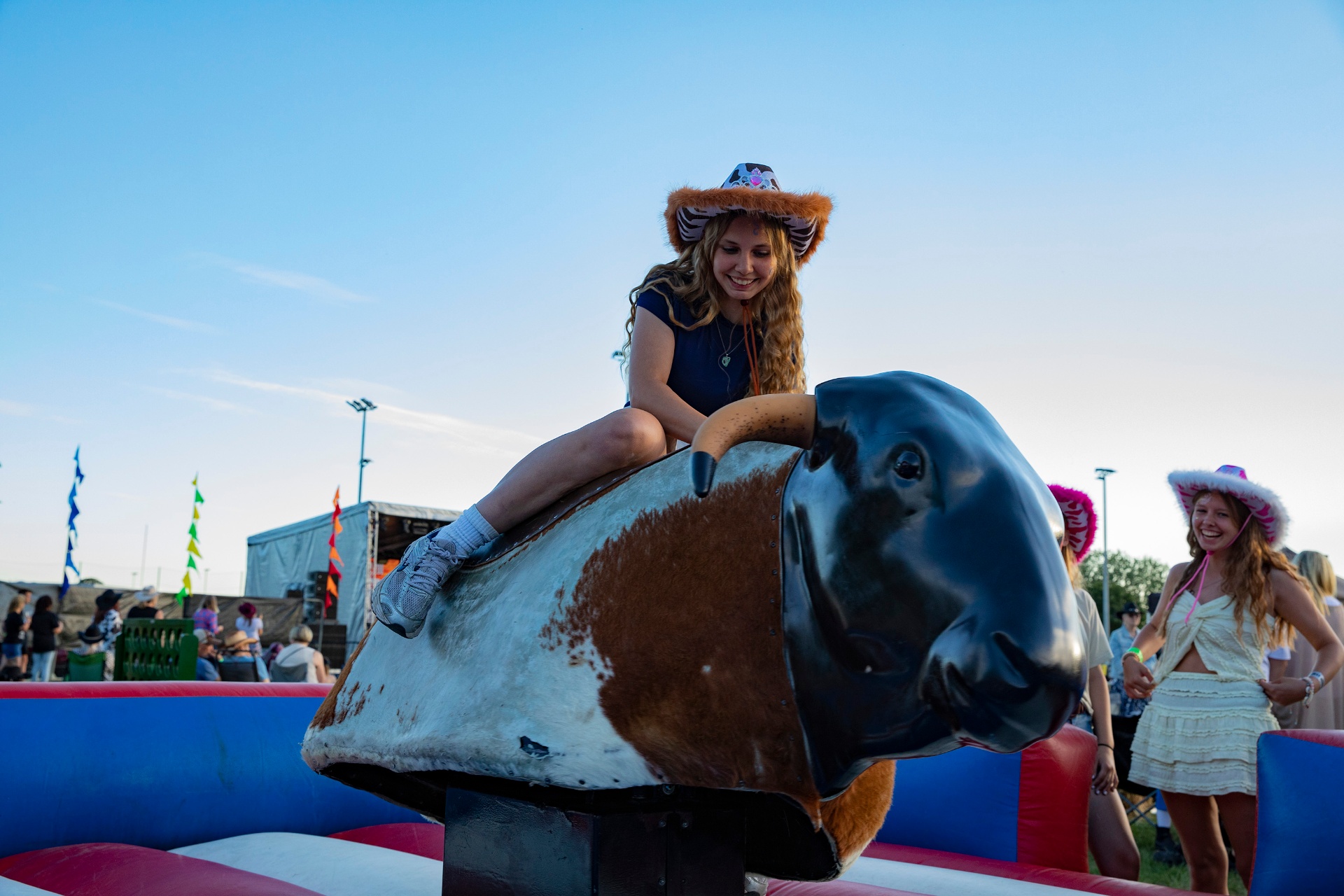 Rider on the mechanical bull at golden hour.